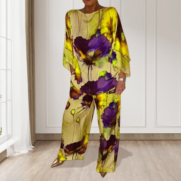 Zweiteiliges Damen Set mit weiter Hose und Oberteil mit langen Ärmeln und floralem Muster