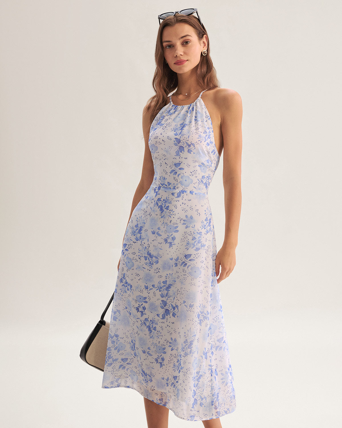 Midi Kleid mit Blumendruck und stilvollem Nackenträger Schnitt