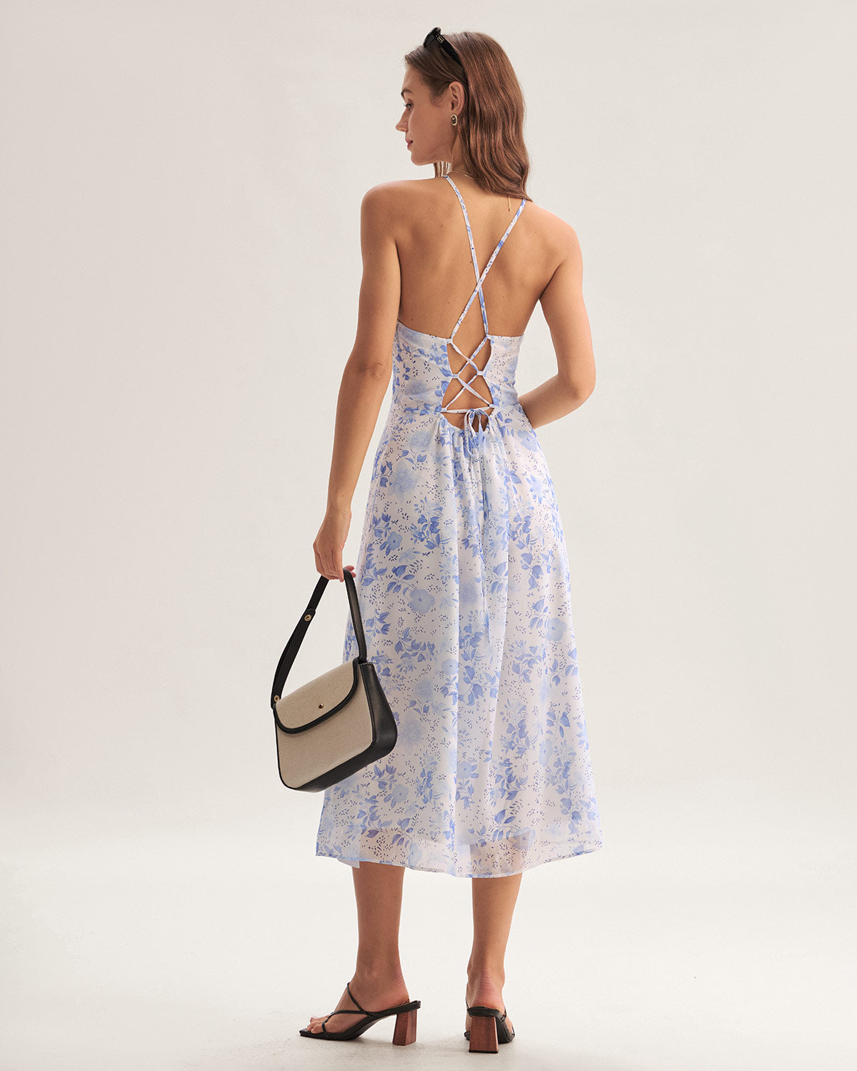 Midi Kleid mit Blumendruck und stilvollem Nackenträger Schnitt